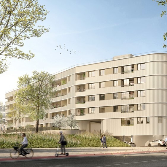 Ansicht des Wohnprojekts in Baumkirchen Mitte. Ein geschwungenes, modernes Gebäude mit Loggien.
